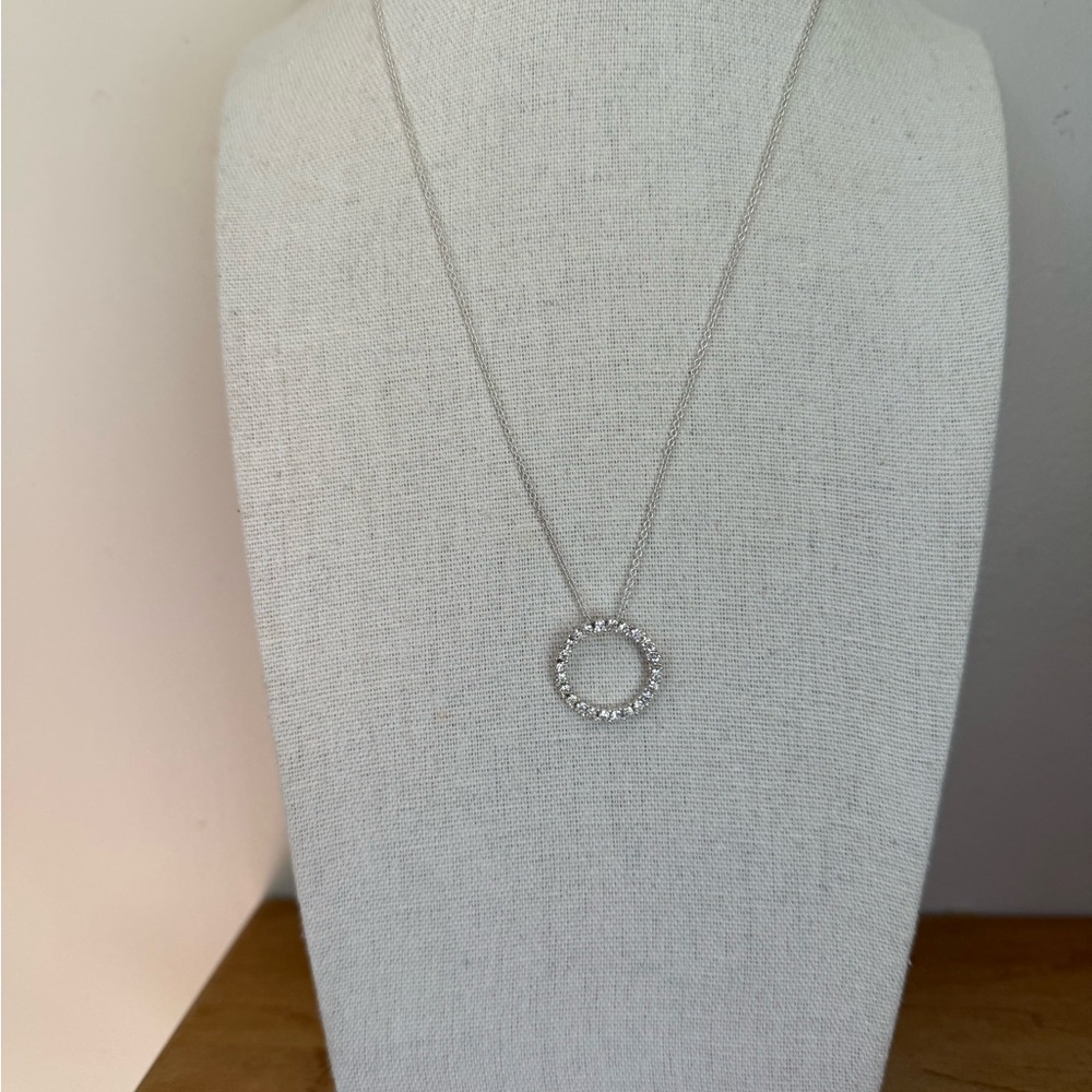Vintage signed AVON crystal circle pendant in silvertone setting, original box